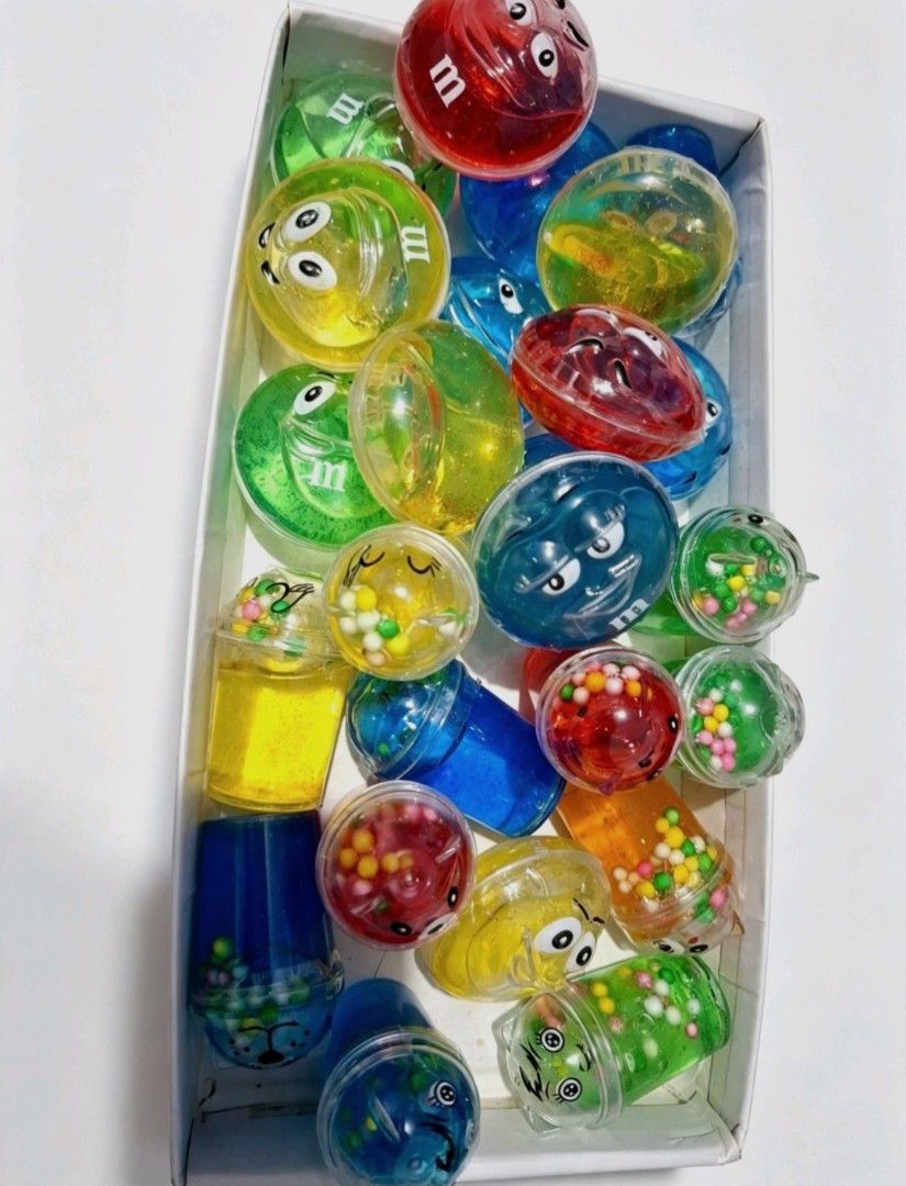 Non-toxic Slime - sold each (Category: Kids Toys) located in Quezon City. Submitted by ana-chan (Listing ID 1456386418, Image 2). Description: Fun M&M themed stress balls and slime toys in bright colors. Perfect for fidgeting, party favors, or gifts. Get yours for stress relief fun!.