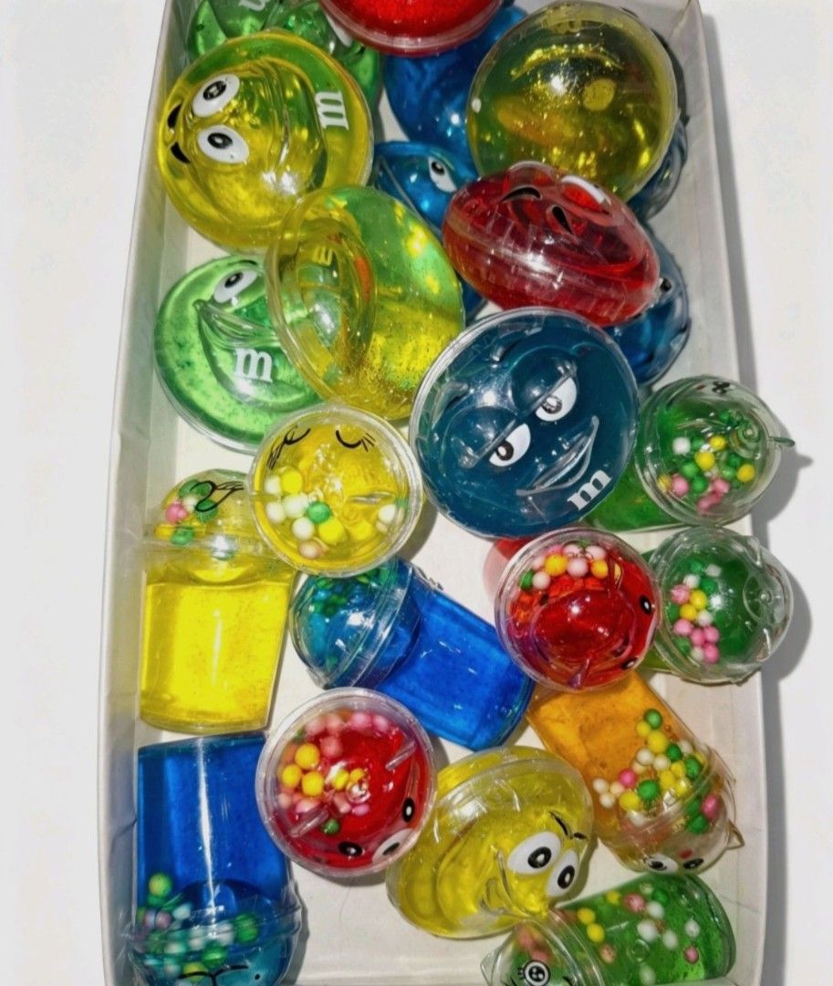 Non-toxic Slime - sold each (Category: Kids Toys) located in Quezon City. Submitted by ana-chan (Listing ID 1456386418, Image 1). Description: Fun M&M themed stress balls and slime toys in bright colors. Perfect for fidgeting, party favors, or gifts. Get yours for stress relief fun!.