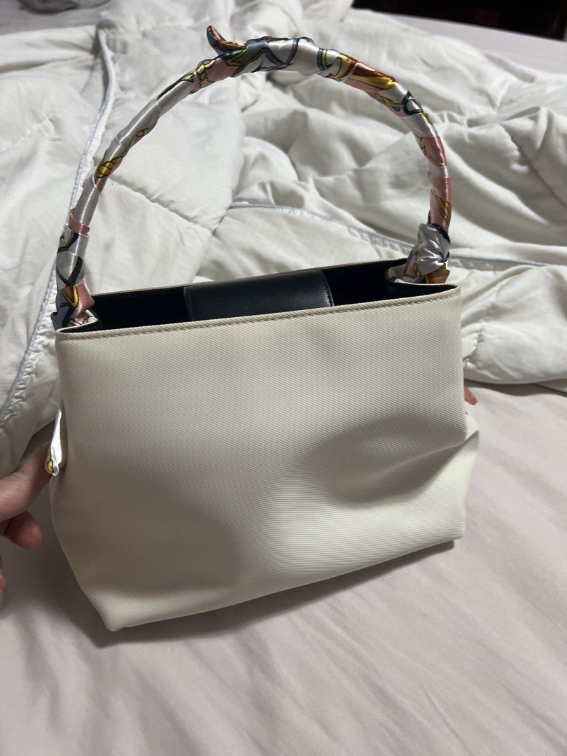 Original Coach White and Black Canvas Handbag with Scarf Handle (Category: Shoulder Bags) located in Cavite. Submitted by corp22 (Listing ID 1456237694, Image 1). Description: - Original Coach handbag - White and black canvas with black leather base and trim - Unique colorful scarf-wrapped handles - Organized interior with zippered pockets - Clean condition - Ideal for everyday use.