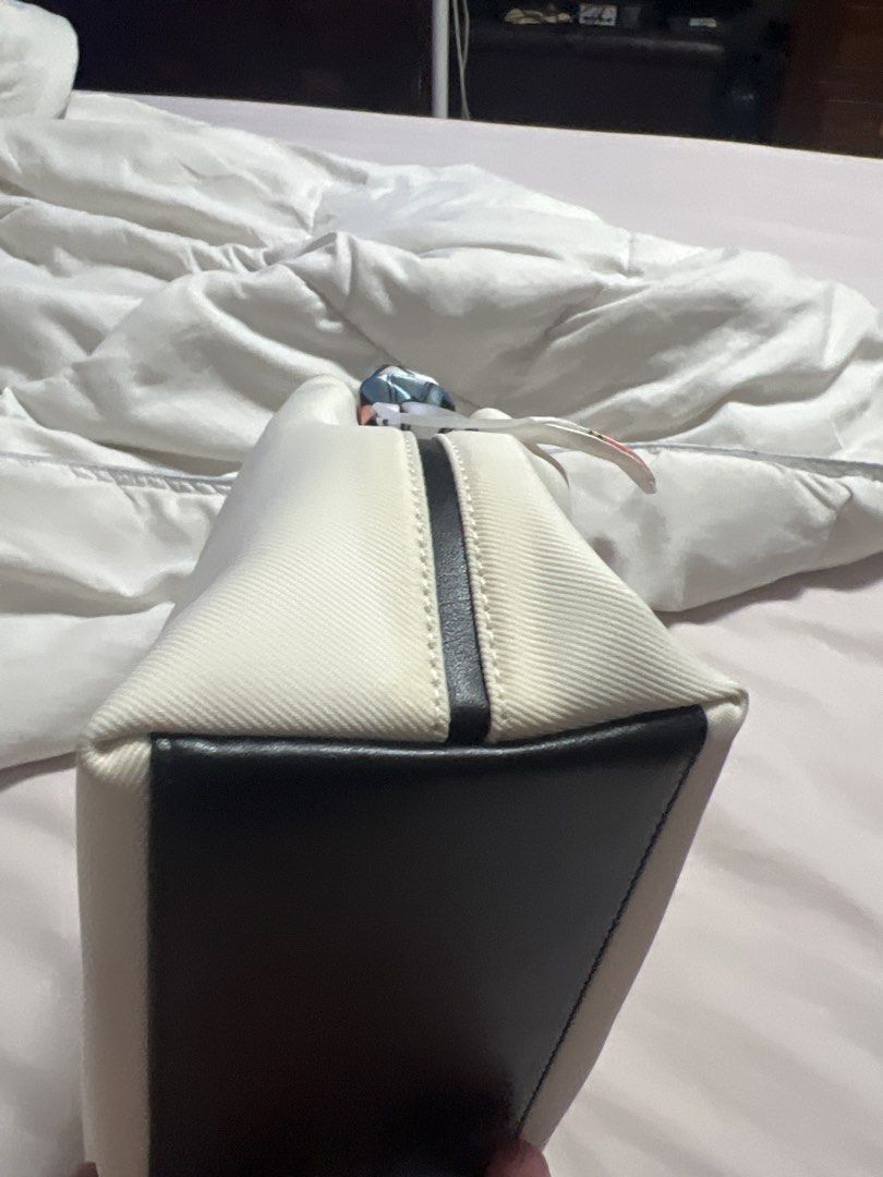 Original Coach White and Black Canvas Handbag with Scarf Handle (Category: Shoulder Bags) located in Cavite. Submitted by corp22 (Listing ID 1456237694, Image 3). Description: - Original Coach handbag - White and black canvas with black leather base and trim - Unique colorful scarf-wrapped handles - Organized interior with zippered pockets - Clean condition - Ideal for everyday use.