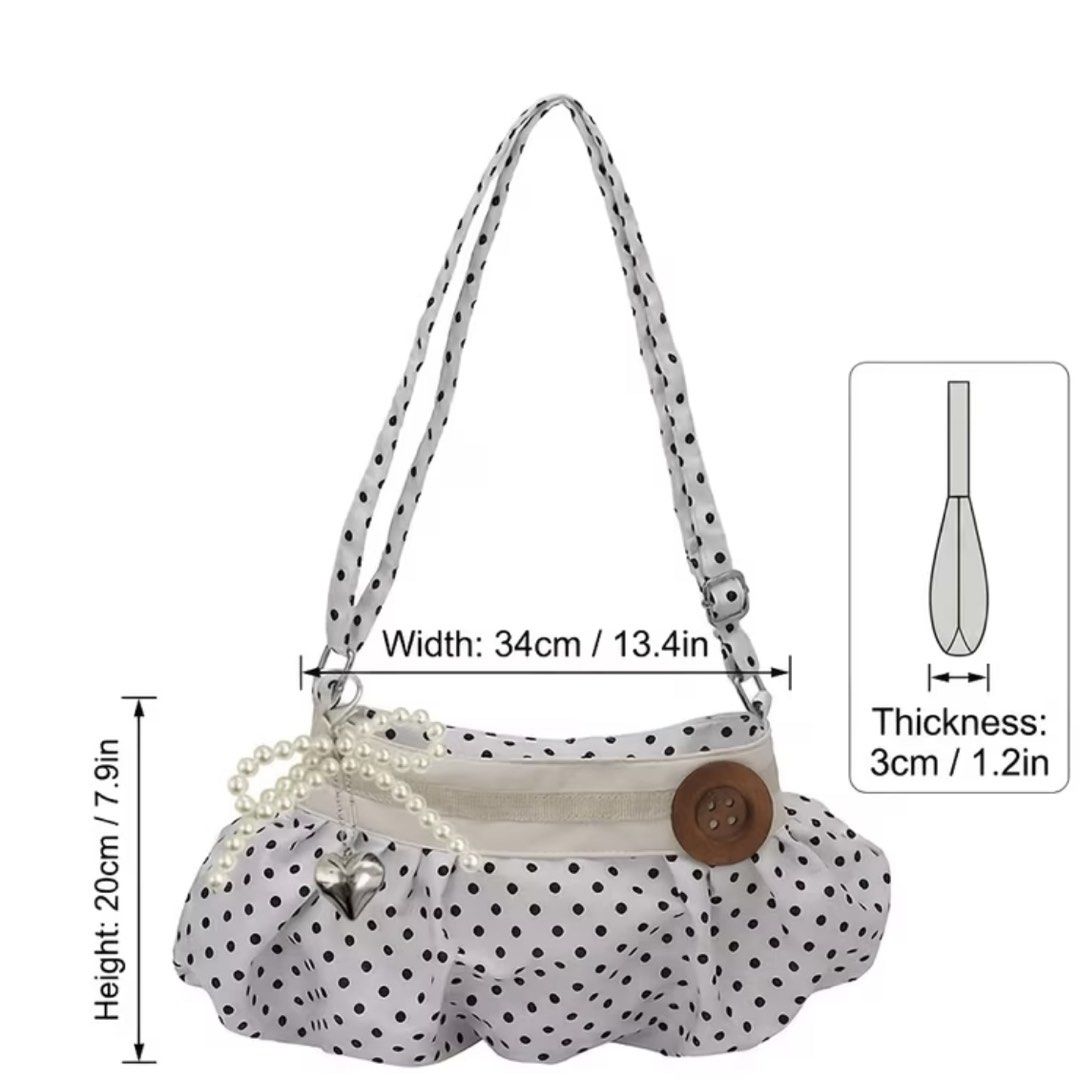 Polka Dot Ruffle Handbag with Heart Charm (Category: Tote Bags) located in Malabon City. Submitted by spamwithegg (Listing ID 1456334092, Image 2). Description: - Adorable polka dot design - Chic ruffled hem detail - Unique wooden button closure - Pretty pearl bow with a heart charm - Adjustable strap for comfortable wear - Dimensions: Width 34cm, Height 20cm, Thickness 3cm.