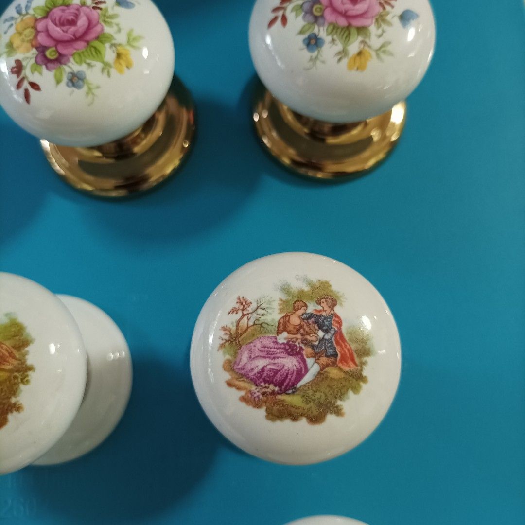 Porcelain knobs (Category: Other Home Decor) located in Singapore. Submitted by chk8888 (Listing ID 1456306328, Image 2). Description: - Set of charming porcelain knobs - Features delicate floral patterns and romantic pastoral scenes - Elegant gold-toned bases - Ideal for cabinets, drawers, and furniture restoration - Adds a vintage and classic aesthetic - Available for meetups at Hillion Mall MRT Plaza (Outside Bukit Panjang MRT).
