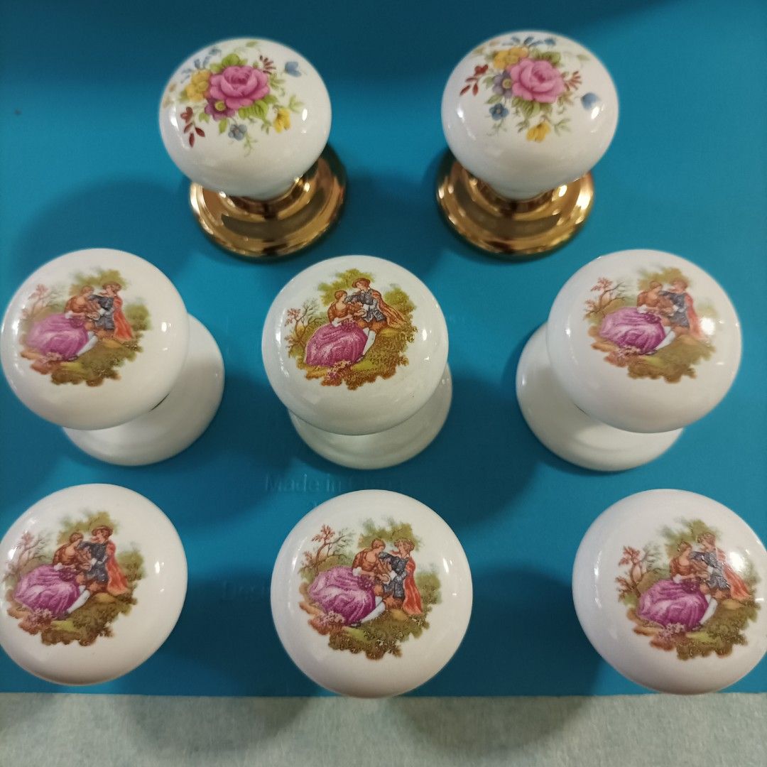 Porcelain knobs (Category: Other Home Decor) located in Singapore. Submitted by chk8888 (Listing ID 1456306328, Image 1). Description: - Set of charming porcelain knobs - Features delicate floral patterns and romantic pastoral scenes - Elegant gold-toned bases - Ideal for cabinets, drawers, and furniture restoration - Adds a vintage and classic aesthetic - Available for meetups at Hillion Mall MRT Plaza (Outside Bukit Panjang MRT).