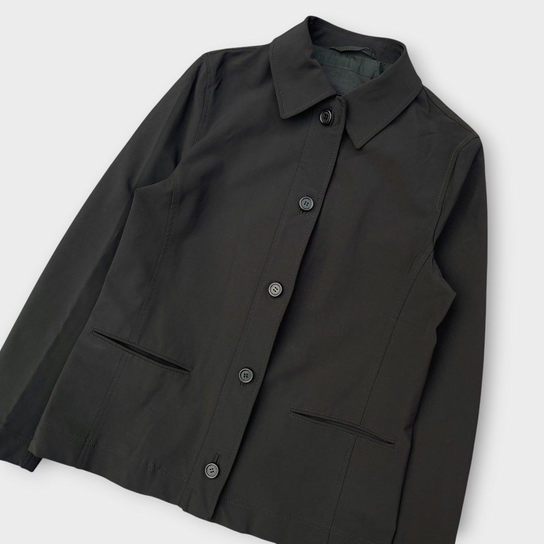 Prada - Vintage - 90s Single-breasted Nylon Jacket (Category: Coats, Jackets and Outerwear) located in Los Banos. Submitted by declutterking (Listing ID 1456415387, Image 2). Description: Size 40 on tag • 2 front pockets • 95% nylon Dimensions: 14.75" shoulders 18" chest 25" length 23.5" sleeves Good as new condition Authentic.