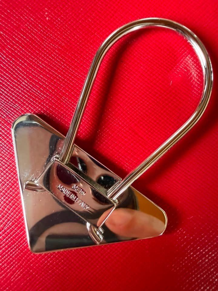Prada Key Holder (Category: Luxury Accessories) located in Quezon City. Submitted by liezl.marie (Listing ID 1456305855, Image 3). Description: Authentic vintage Pr@da silver-tone metal triangle logo clip key holder. 4500 Open for layaway. Disclaimer: We are not affiliated, associated, authorized, endorsed by or in any way officially connected with any other company or luxury brand. All copyrights are reserved to the original brand..
