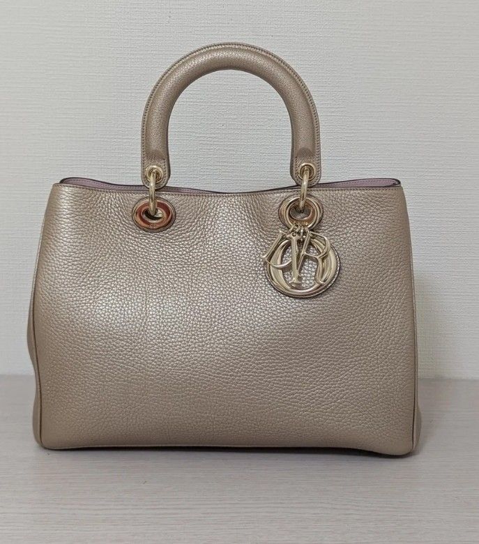 Preloved Authentic Diorissimo VIP Champagne Gold (Category: Luxury Bags & Wallets) located in Quezon City. Submitted by kairobkoy (Listing ID 1456348633, Image 1). Description: Preloved Authentic Diorissimo VIP Champagne Gold Grained calfskin leather.
