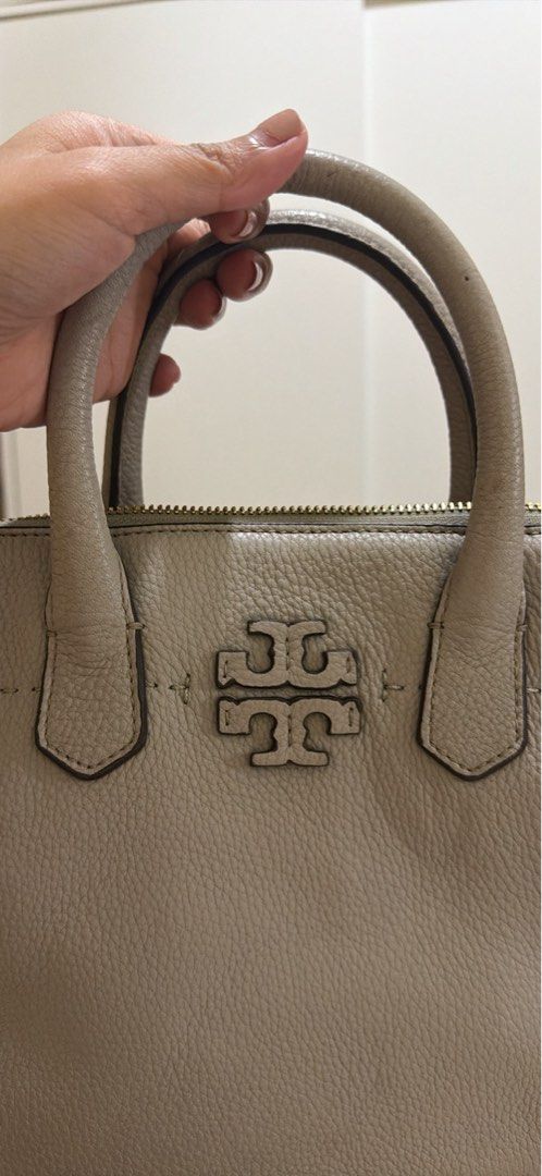 Preloved authentic Tory Burch Grey Leather Satchel Handbag (Category: Luxury Bags & Wallets) located in Binangonan. Submitted by thingsbymargs (Listing ID 1456411135, Image 2). Description: Light gray/taupe color Small tote 3 compartments No sling Signs of usage but no issues, all parts are intact Free shipping Can negotiate but not free SF Please pm for more pics and if interested RFS: decluttering, not used for a long time.