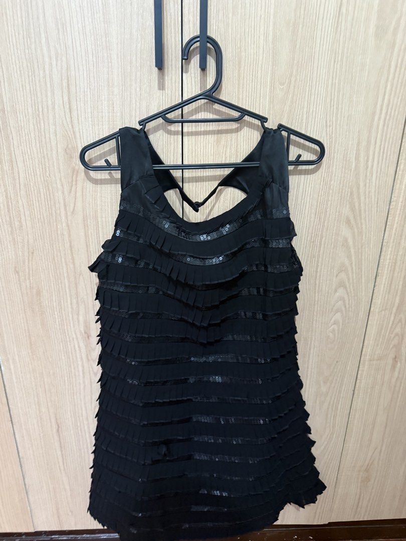 RAGA Black Sequin Tiered Mini Dress (Category: Dresses) located in Las Pinas. Submitted by rachcb (Listing ID 1456301847, Image 2). Description: RAGA sequined ruffled pleat dress, brandnew S-M black side zipper closure back keyhole ruffled pleats lined 65% rayon, 35% polyester F x 34 x 33 in - Horizontal tiers with sequin detailing - Slightly ruffled hemline - Ideal for parties, events, or a night out - Pairs perfectly with heels.