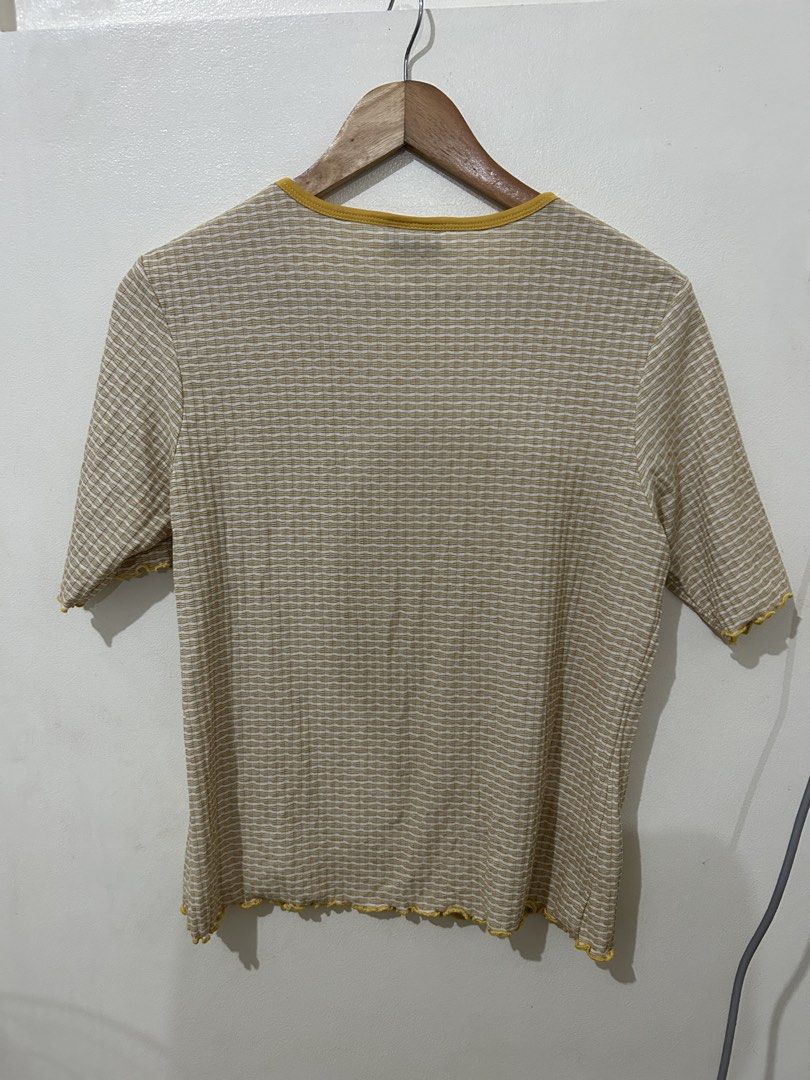Ribbed T-shirt with Yellow Trim (Category: Shirts) located in Manila. Submitted by kxkcx (Listing ID 1456375249, Image 3). Description: - Cute t-shirt - Tan and white stripes - Yellow neckline and hem - Lettuce edge detail on sleeves and bottom - Short sleeves, crew neck - Great for casual wear.