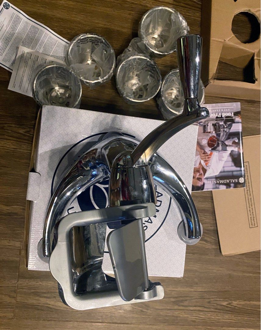 Saladmaster food processor (Category: Other Kitchenware & Tableware) located in Angeles City. Submitted by noagrace (Listing ID 1456324672, Image 3). Description: Almost new, tried it once and back to box Reason for selling: i have 2 sets, Cutting Cones: Comes with 5 interchangeable 304 stainless steel cones for slicing, shredding, grating, stringing, and waffling.Durability: Built with a heavy-duty zinc die-cast, chrome-plated body designed for 