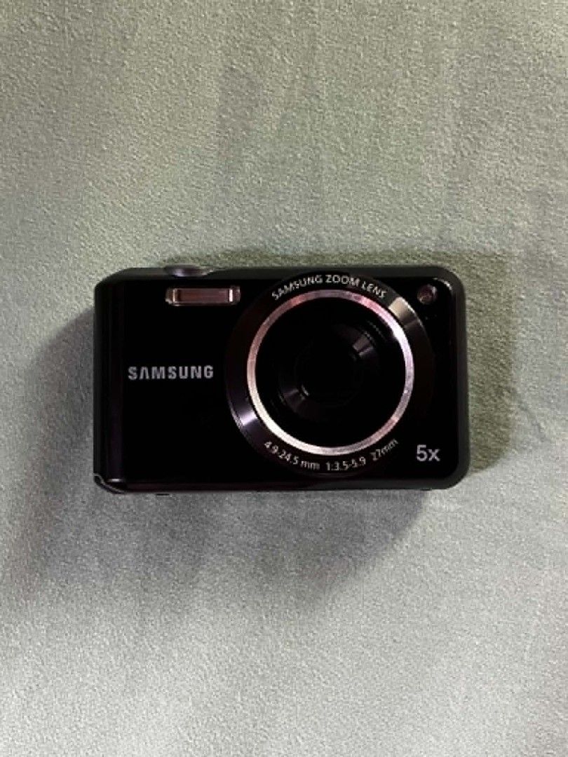 Samsung ES65 Digital Camera 5x Optical Zoom (Category: Cameras) located in Manila. Submitted by jielmabale (Listing ID 1456332566, Image 1). Description: SAMSUNG ES65⋆.𐙚 ̊. ♡ Details: It’s a compact digital camera with 10.2 megapixels CCD sensor. It features 5x optical zoom. Includes Face Detection, Digital Image Stabilization, Smart Auto, and various scene modes for easy point-and-shoot photography. Flash working, zoom working. ♡ Issues: No iss