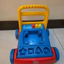 Step2 Walker Wagon Red Blue Yellow (Category: Infant Playtime) located in Manila. Submitted by gencomanila (Listing ID 1456277650, Image 1). Description: - Fun walker wagon to help babies learn to walk - Bright red, blue, and yellow colors - Features a shape sorter on the front - Sturdy build for stability - Shows minor scuffs from normal play.