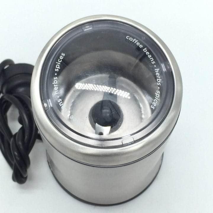 SUNBEAM EM0405 Personal Coffee Bean Grinder (Category: Coffee Machines & Makers) located in Pasay City. Submitted by enrico_appliances (Listing ID 1456305540, Image 2). Description: - Brand: Sunbeam - Model: EM0405 - Material: Durable stainless steel - Design: Compact and sleek - Operation: Simple one-touch press button - Functionality: Grinds coffee beans, herbs, and spices - Benefit: Enjoy freshly ground ingredients at home -Brand: Sunbeam Mode