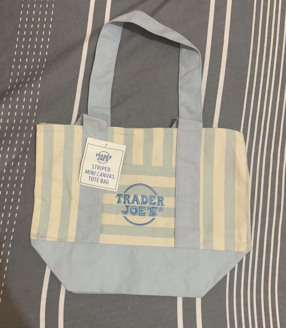 Trader Joe's Mini Canvas Striped Tote Bag (Category: Tote Bags) located in Cavite. Submitted by shielag76 (Listing ID 1456333006, Image 2). Description: - Cute mini tote bag from Trader Joe's 🍏 Green 🩷 Pink 🔵 Blue - Small front pocket with embroidered Trader Joe's logo - Ideal for carrying small essentials.