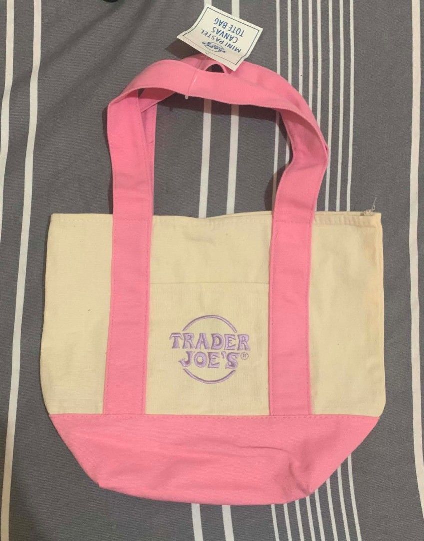 Trader Joe's Mini Canvas Striped Tote Bag (Category: Tote Bags) located in Cavite. Submitted by shielag76 (Listing ID 1456333006, Image 1). Description: - Cute mini tote bag from Trader Joe's 🍏 Green 🩷 Pink 🔵 Blue - Small front pocket with embroidered Trader Joe's logo - Ideal for carrying small essentials.