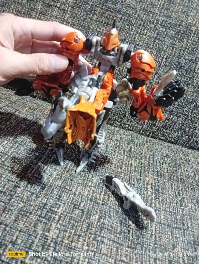 Transformers Age of Extinction Grimlock Action Figure (Category: Action & Battle Toys) located in Caloocan City. Submitted by htorrelino (Listing ID 1456335596, Image 3). Description: - Transformers Age of Extinction Grimlock Action Figure - Color: Orange, Grey, and Black - Features: Transforms, potentially detachable parts - Ideal for: Any Transformers fan as is wysiwyg.