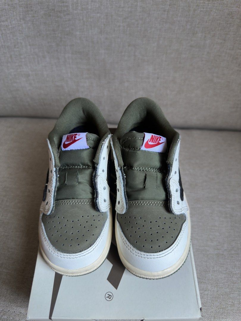 Travis Scott Med Olive 8c (Category: Babies & Kids Fashion) located in Laoag. Submitted by swttrish (Listing ID 1456359183, Image 2). Description: No issue Complete shoe laces with unused pink lace With sticker 💯 auth. Loc: Laoag City Can ship thru jnt SF will be shouldered by buyer Pass sa low baller. Bought BN.