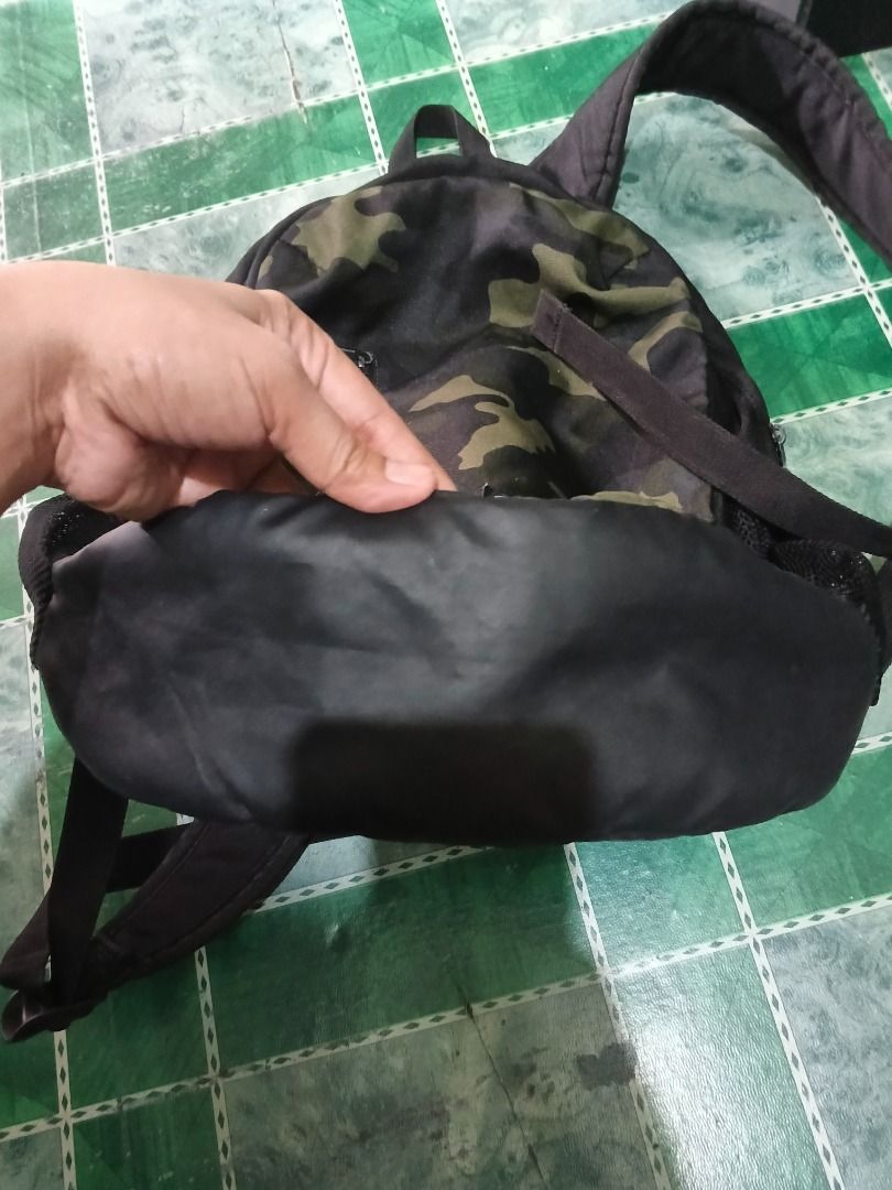 Under Armour Camo Backpack (Category: Backpacks) located in Urdaneta. Submitted by fastbird.12354e (Listing ID 1456275159, Image 3). Description: - Stylish camouflage print Under Armour backpack - Convenient front zip pocket - Handy mesh side pockets for water bottles or essentials - Spacious main compartment for all your gear - Durable zippers featuring the Under Armour logo - Ideal for school, gym, or everyday use.