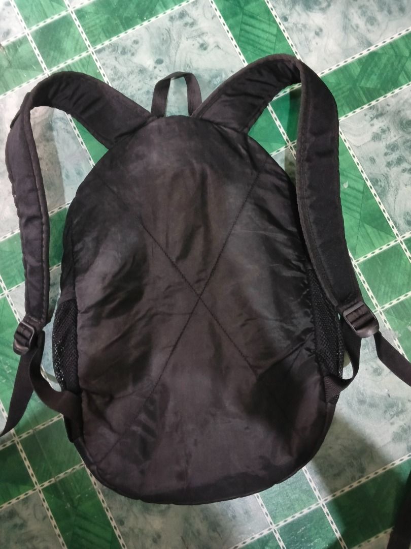 Under Armour Camo Backpack (Category: Backpacks) located in Urdaneta. Submitted by fastbird.12354e (Listing ID 1456275159, Image 2). Description: - Stylish camouflage print Under Armour backpack - Convenient front zip pocket - Handy mesh side pockets for water bottles or essentials - Spacious main compartment for all your gear - Durable zippers featuring the Under Armour logo - Ideal for school, gym, or everyday use.