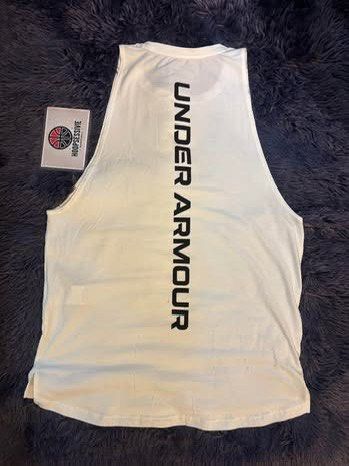 Under Armour White Sleeveless Tank Top (Category: Activewear) located in Manila. Submitted by hoopsessive (Listing ID 1456418115, Image 1). Description: - White Under Armour tank top - Sleeveless design - Large Under Armour logo on the back - Small logo on the front chest - Ideal for workouts or casual wear - Comfortable and breathable material.