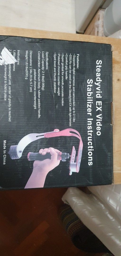 VDO camera stabilizer (Category: Travel Essentials & Accessories) located in Singapore. Submitted by tithima (Listing ID 1456361028, Image 1). Description: - Steadyvid EX Video Stabilizer - Supports digital cameras, camcorders, and DSLRs (with light lenses) up to 2.1 lbs (0.95kg) - Features a comfort grip handle for extended use - Equipped with a super gimbal for smooth, accurate motion - Includes a polished chrome counterweight for balance - Bui