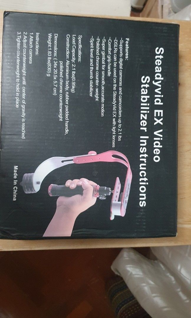 VDO camera stabilizer (Category: Travel Essentials & Accessories) located in Singapore. Submitted by tithima (Listing ID 1456361028, Image 4). Description: - Steadyvid EX Video Stabilizer - Supports digital cameras, camcorders, and DSLRs (with light lenses) up to 2.1 lbs (0.95kg) - Features a comfort grip handle for extended use - Equipped with a super gimbal for smooth, accurate motion - Includes a polished chrome counterweight for balance - Bui