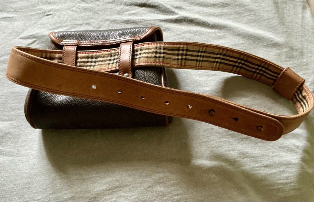 Vintage Burberrys Belt Bag (Category: Purses & Pouches) located in Tabuk. Submitted by atticgalore (Listing ID 1456264772, Image 2). Description: Made in Italy Snap on lock does not open easily Fits waist size 28 inches or smaller Bag size is 5inches wide 6 inches long & 2 inches thick at the bottom.