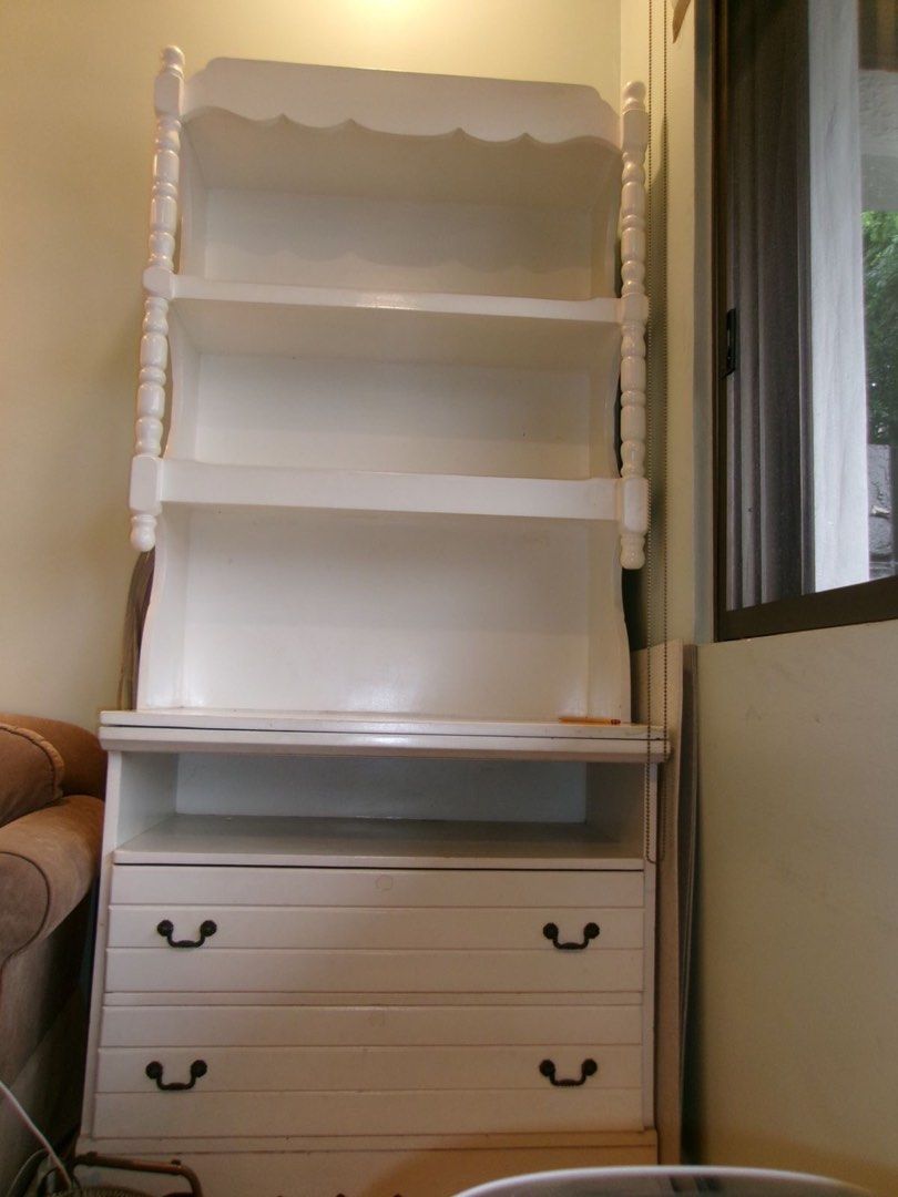 Vintage white solid wood bookshelf and desk (Category: Shelves, Cabinets & Racks) located in Muntinlupa City. Submitted by tpb586 (Listing ID 1456271698, Image 2). Description: - From the 1960s - With pull out desk - Two shelves for display or books - Two drawers and One open shelf at the bottom - Ideal for bedrooms or study areas - Selling because of redecoration - Size: 35 x 19.5 x 78 inches Shipping c/o buyer. Payment via gcash or bank transfe