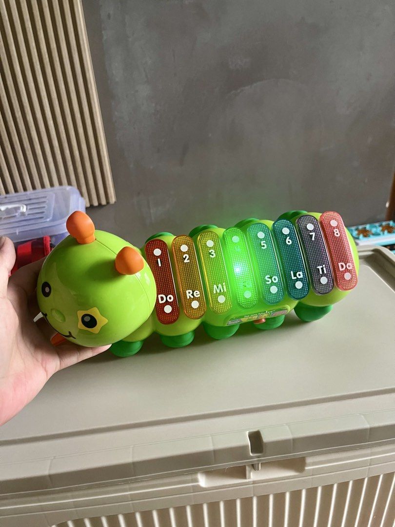 VTECH Xylophone (Category: Educational & Learning Toys) located in Quezon City. Submitted by basicsandessentials (Listing ID 1456288336, Image 2). Description: - 100% working -Fun caterpillar xylophone toy - Plays different musical notes - Lights up when played - Comes with a mallet - Perfect for little ones learning music - Bright green color - Batteries not included (AAx2) MOP:Bank transfer/ GCASH ❌No return, exchange or change of mind returns 