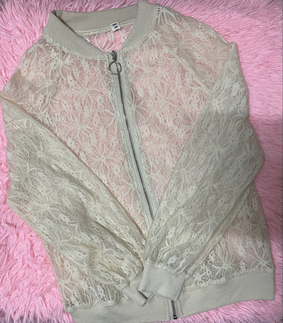 White Lace Bomber Jacket (Category: Coats, Jackets and Outerwear) located in Tabuk. Submitted by zenwolf-1867 (Listing ID 1456331799, Image 2). Description: - Sheer white lace bomber jacket - Pink lining underneath - Zipper front closure with a ring pull - Ribbed collar, cuffs, and hem - Perfect for layering over camis or bralettes.