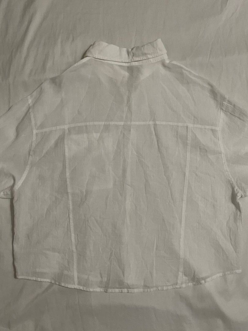 White Polo Button Down Beach Cover Up Shirt (Category: Shirts) located in Binan City. Submitted by declutterbyjwy (Listing ID 1456388255, Image 3). Description: - can fit xs-l - cotton fabric - lightweight & sheer - good as new, never used - no flaws, no stains.