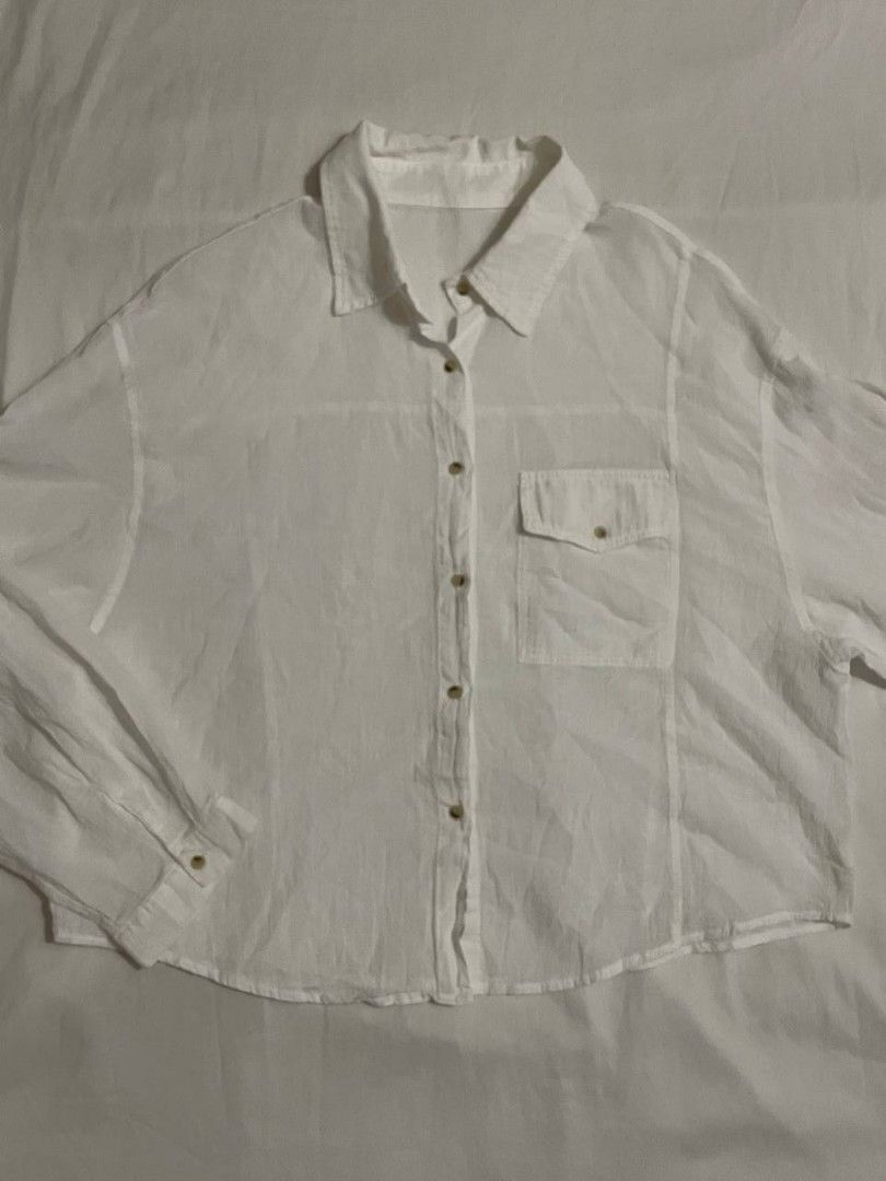 White Polo Button Down Beach Cover Up Shirt (Category: Shirts) located in Binan City. Submitted by declutterbyjwy (Listing ID 1456388255, Image 1). Description: - can fit xs-l - cotton fabric - lightweight & sheer - good as new, never used - no flaws, no stains.