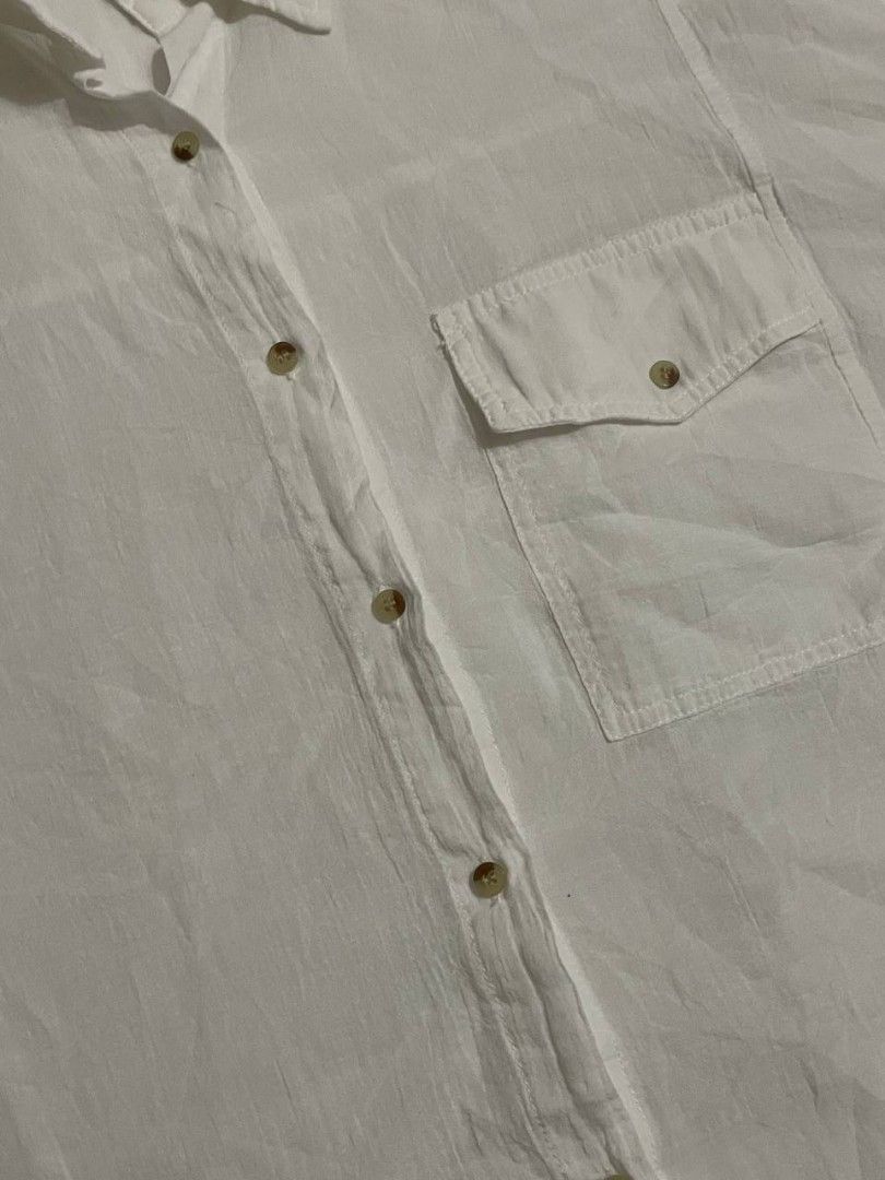 White Polo Button Down Beach Cover Up Shirt (Category: Shirts) located in Binan City. Submitted by declutterbyjwy (Listing ID 1456388255, Image 2). Description: - can fit xs-l - cotton fabric - lightweight & sheer - good as new, never used - no flaws, no stains.