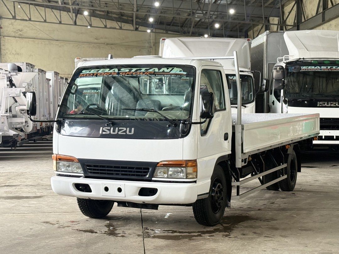 4HE1 inline Isuzu Elf Dropside 17ft NPR mwelye (Category: Heavy Vehicles) located in Bulacan. Submitted by arvin_custodio (Listing ID 1456502539, Image 1). Description: Isuzu Elf Dropside 17ft NPR 4HE1 engine inline Leafspring front/rear Steel flooring Complete papers Ready to release 📲0919-096-9833.