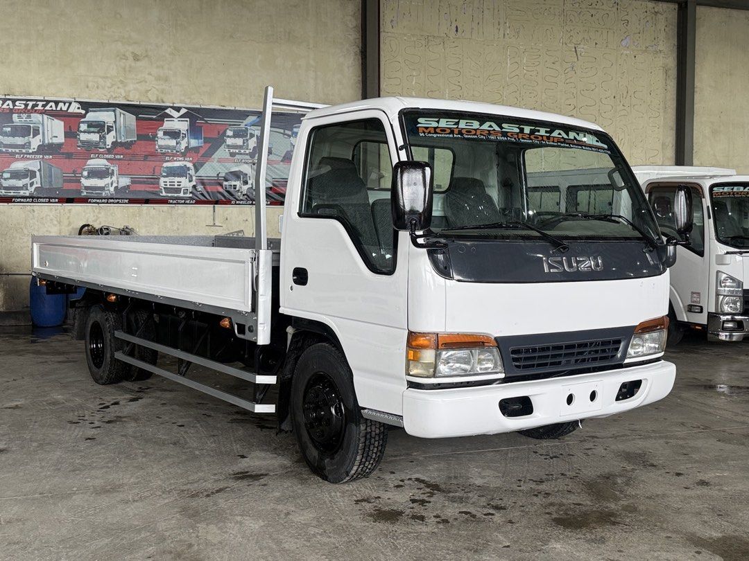 4HE1 inline Isuzu Elf Dropside 17ft NPR mwelye (Category: Heavy Vehicles) located in Bulacan. Submitted by arvin_custodio (Listing ID 1456502539, Image 2). Description: Isuzu Elf Dropside 17ft NPR 4HE1 engine inline Leafspring front/rear Steel flooring Complete papers Ready to release 📲0919-096-9833.