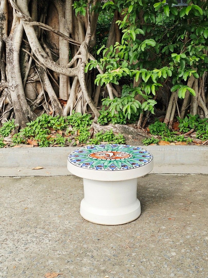 A sturdy, heavy & glossy ceramic coffee table, (Category: Tables & Sets) located in Guiguinto. Submitted by eypee_knows (Listing ID 1456460275, Image 2). Description: A sturdy, heavy & glossy ceramic coffee table, This item is handmade a features a handwritten sun design It is baked in color that represents Shirigaki *In great condition Dimensions: 24 x 24 inches H- 17.5.