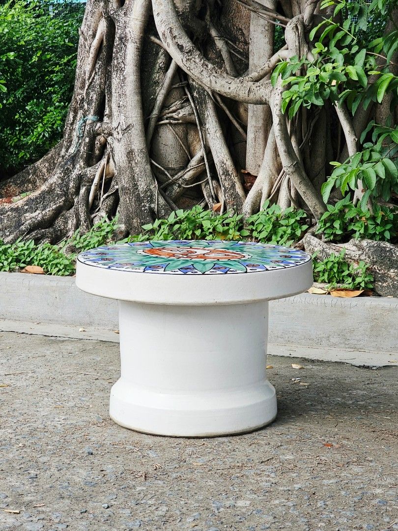 A sturdy, heavy & glossy ceramic coffee table, (Category: Tables & Sets) located in Guiguinto. Submitted by eypee_knows (Listing ID 1456460275, Image 3). Description: A sturdy, heavy & glossy ceramic coffee table, This item is handmade a features a handwritten sun design It is baked in color that represents Shirigaki *In great condition Dimensions: 24 x 24 inches H- 17.5.