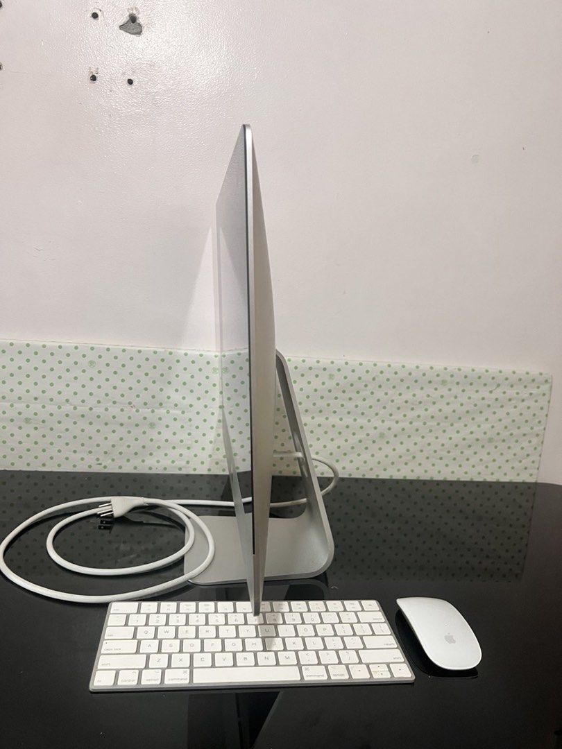 Apple iMac 21.5-inch Desktop Computer with Keyboard and Mouse (Category: Desktops) located in Paranaque City. Submitted by enchanting_f1nds (Listing ID 1456497672, Image 3). Description: - 2021 acquired - Sleek silver Apple iMac desktop computer - Original Magic Keyboard included - Original Magic Mouse included - Ideal all-in-one setup for home or office - Power cable included - Ready for a new owner.