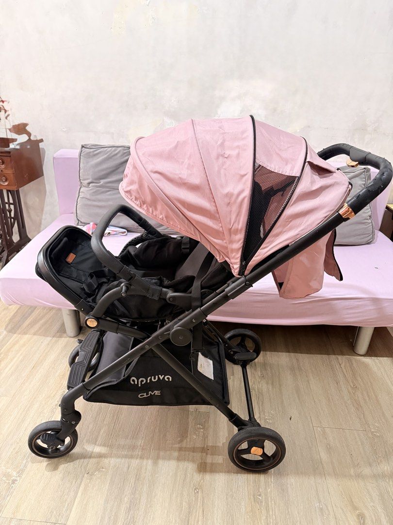 Apruva Clive Reversible Stroller (Category: Strollers) located in Quezon City. Submitted by jizpsa (Listing ID 1456486235, Image 2). Description: Apruva Clive Reversible Stroller Color Nude Pink Not lightweight and very sturdy. Reclining seat. Best for newborn up to toddler. 8k original price .