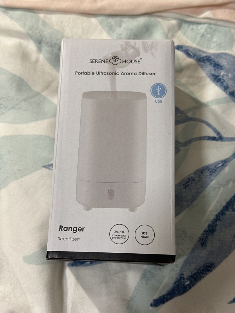 Aroma diffuser (Category: Home Fragrance) located in Singapore. Submitted by kanmon (Listing ID 1456526606, Image 1). Description: Brand new, never used, received as a gift. Portable as it is charged with a USB. To be used with water and essential oils. .