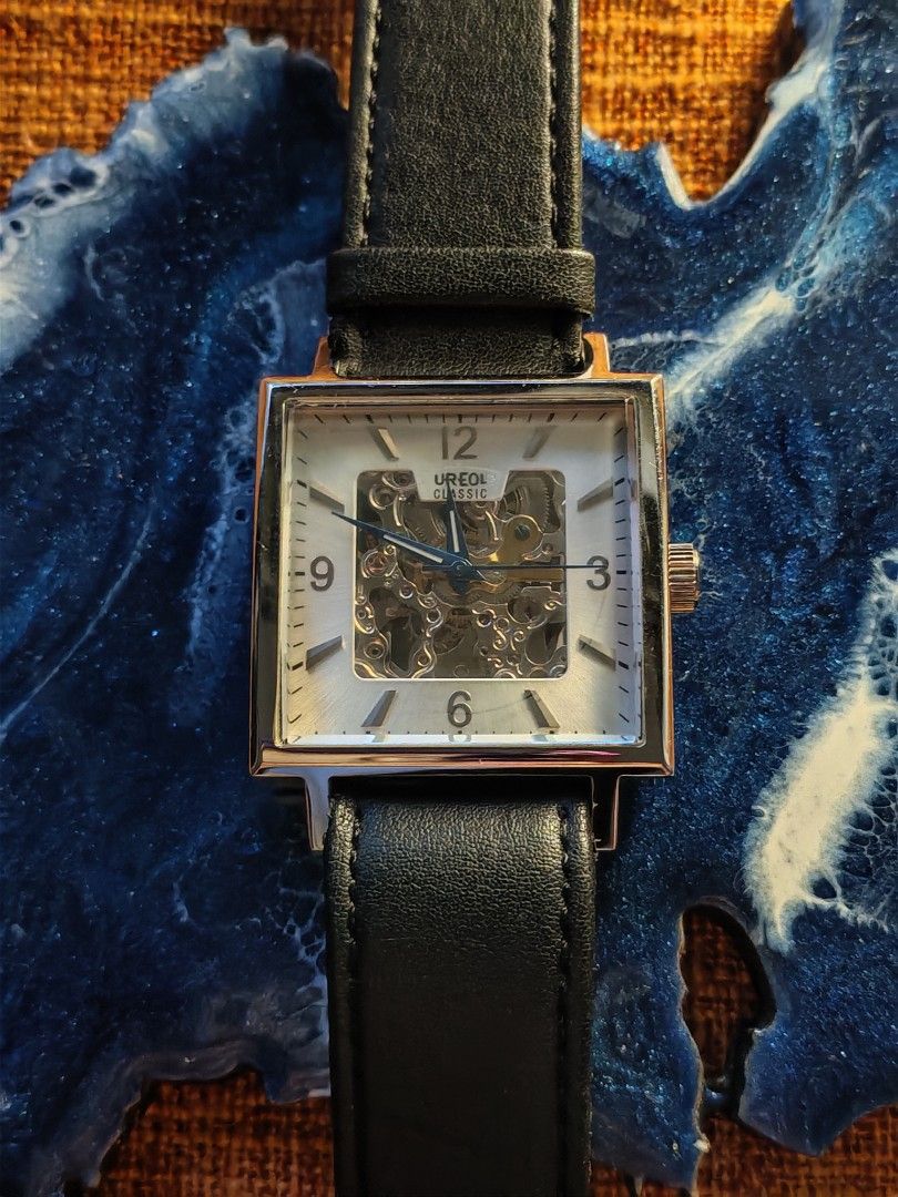 Aureole Classic Square Automatic Skeleton Watch (Category: Men's Watches) located in Trece Martires City. Submitted by heirloomhoursph (Listing ID 1456600096, Image 2). Description: ✨ Heirloom Hours – Available Piece ✨ Aureole Classic Square Automatic Skeleton Watch Php 4,999 + sf Details: ■ Brand/Series: Aureole ■ Model Number: SW-471M) ■ Movement: Automatic Movement ■ Design Origin: Japan ■ Case Back Material: Stainless Steel ■ Case Size: 36mm 