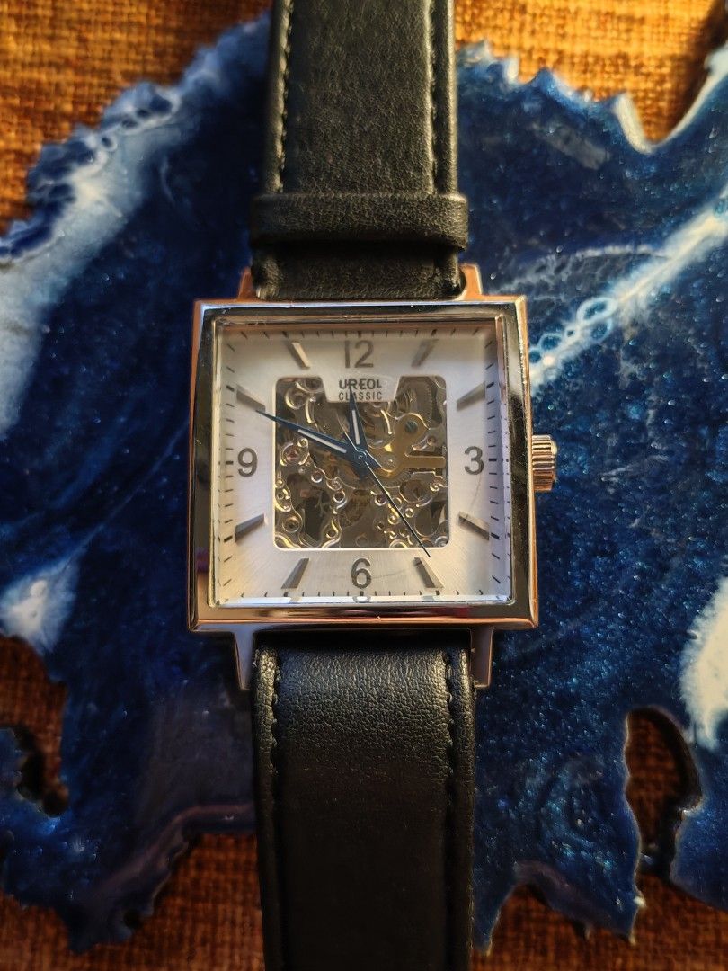 Aureole Classic Square Automatic Skeleton Watch (Category: Men's Watches) located in Trece Martires City. Submitted by heirloomhoursph (Listing ID 1456600096, Image 3). Description: ✨ Heirloom Hours – Available Piece ✨ Aureole Classic Square Automatic Skeleton Watch Php 4,999 + sf Details: ■ Brand/Series: Aureole ■ Model Number: SW-471M) ■ Movement: Automatic Movement ■ Design Origin: Japan ■ Case Back Material: Stainless Steel ■ Case Size: 36mm 