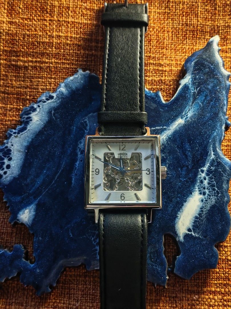 Aureole Classic Square Automatic Skeleton Watch (Category: Men's Watches) located in Trece Martires City. Submitted by heirloomhoursph (Listing ID 1456600096, Image 1). Description: ✨ Heirloom Hours – Available Piece ✨ Aureole Classic Square Automatic Skeleton Watch Php 4,999 + sf Details: ■ Brand/Series: Aureole ■ Model Number: SW-471M) ■ Movement: Automatic Movement ■ Design Origin: Japan ■ Case Back Material: Stainless Steel ■ Case Size: 36mm 