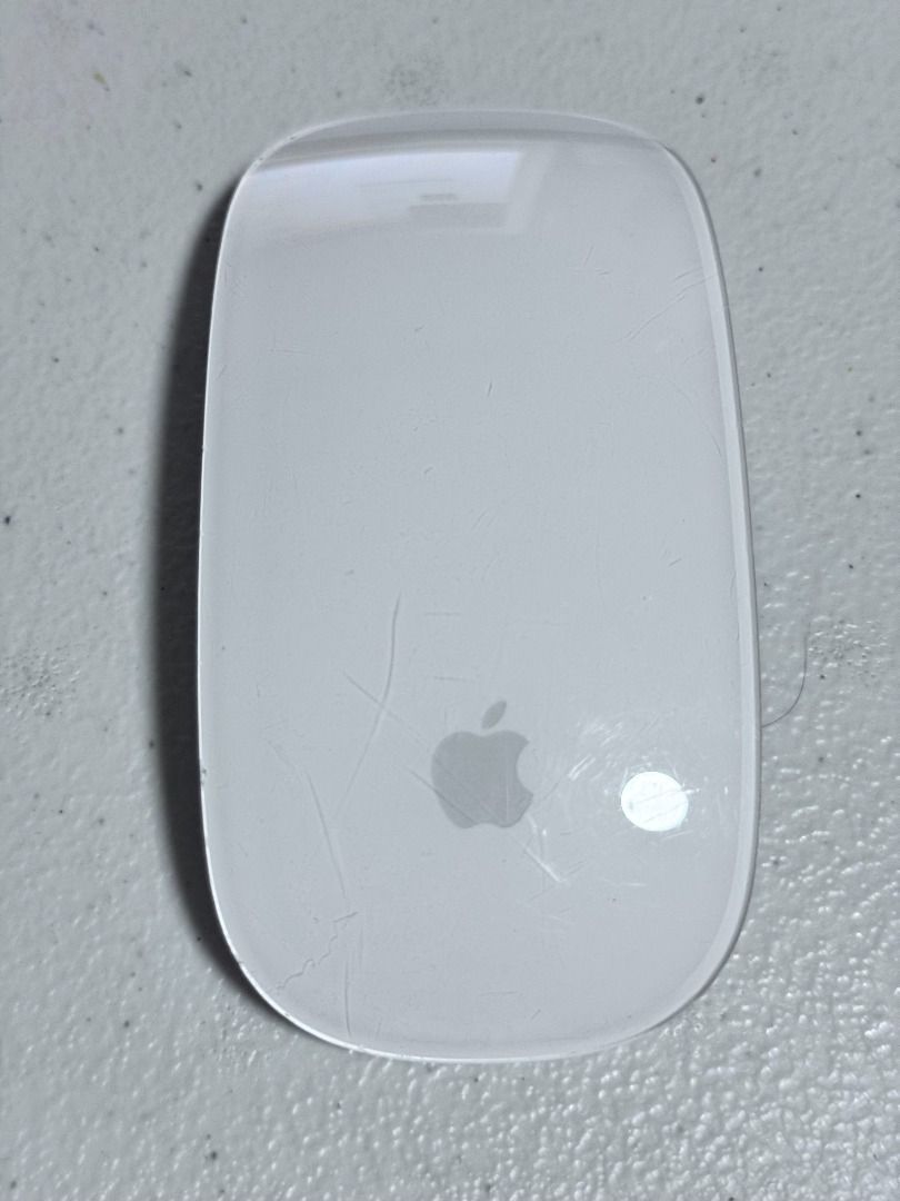 AUTHENTIC Apple Magic Mouse 2 (A1657) (Category: Mouse & Mousepads) located in Makati City. Submitted by mbrtom (Listing ID 1456542231, Image 1). Description: Good working condition. Some scuffs from use (please see photos). As is - Unit only - No box and charger Lightning cable needed to charge Videos available upon request.