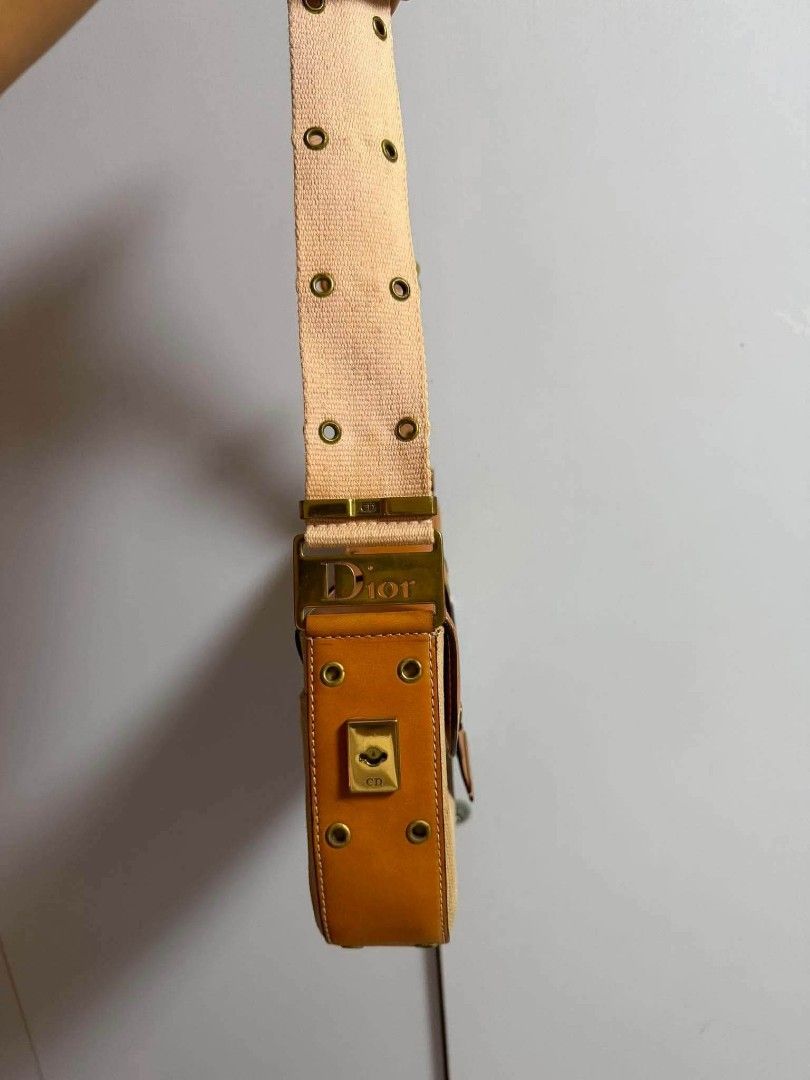 Authentic Christian Dior Canvas & Leather Shoulder Bag (Category: Luxury Bags & Wallets) located in Marikina City. Submitted by aussiemaan (Listing ID 1456529750, Image 3). Description: - Authentic Dior shoulder bag - Beige canvas with tan leather trim - Gold-tone hardware - Dior logo clasp - Adjustable strap with multiple eyelets - Classic and timeless design.