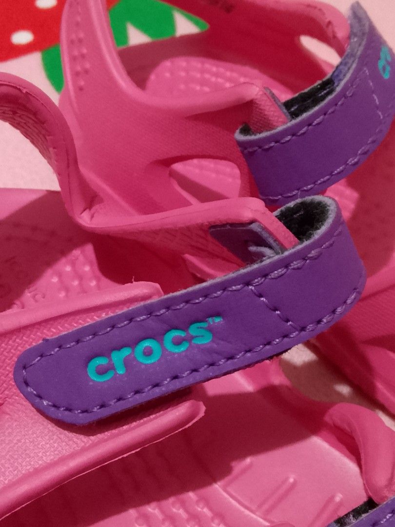 Authentic Crocs Sandals for Kids (Category: Babies & Kids Fashion) located in Roxas City. Submitted by tabot (Listing ID 1456572386, Image 2). Description: - Adorable pink Crocs sandals for kids. (ALMOST NEW) - With djustable purple velcro strap. - Easy to clean and durable material. -Only issue: very minimal pen writing at the back..