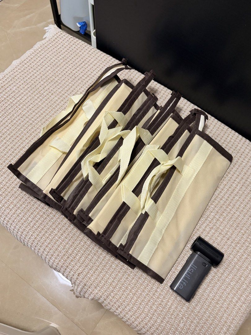 [Read Caption] Bag Storage / Dust Bag (purchase per size or take all) (Category: Storage Boxes & Baskets) located in Taguig. Submitted by _cupkeith (Listing ID 1456433055, Image 1). Description: decluttering! this is for bulk purchase each size or you may also take all. product sizes are in the last photo. *included jisulife in the bags for size reference only* S (6 pcs) - ₱220 M (6 pcs) - ₱290 L (2 pcs) - ₱130 XL (2 pcs) - ₱150 XXL (2 pcs) - ₱17