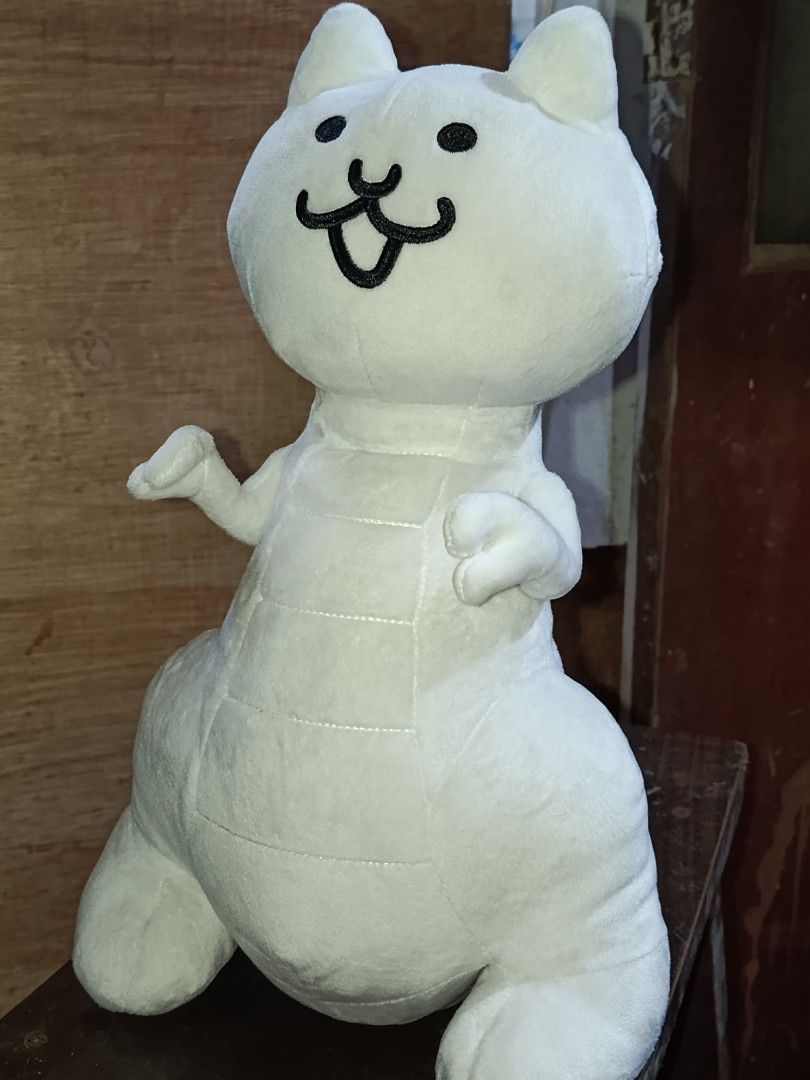 Battle Cats White Cat Dinosaur Plush Toy (Category: Plushies & Soft Toys) located in Manila. Submitted by jelomove (Listing ID 1456501681, Image 1). Description: Super cute white cat dinosaur plush - From the popular game Battle Cats - Soft and cuddly material - Ideal for fans and collectors - Ready to find its new home -40 cm plush height price: 1000.