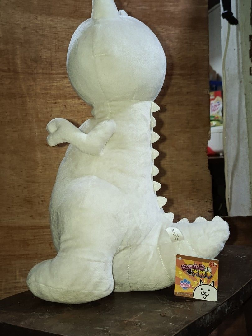 Battle Cats White Cat Dinosaur Plush Toy (Category: Plushies & Soft Toys) located in Manila. Submitted by jelomove (Listing ID 1456501681, Image 2). Description: Super cute white cat dinosaur plush - From the popular game Battle Cats - Soft and cuddly material - Ideal for fans and collectors - Ready to find its new home -40 cm plush height price: 1000.