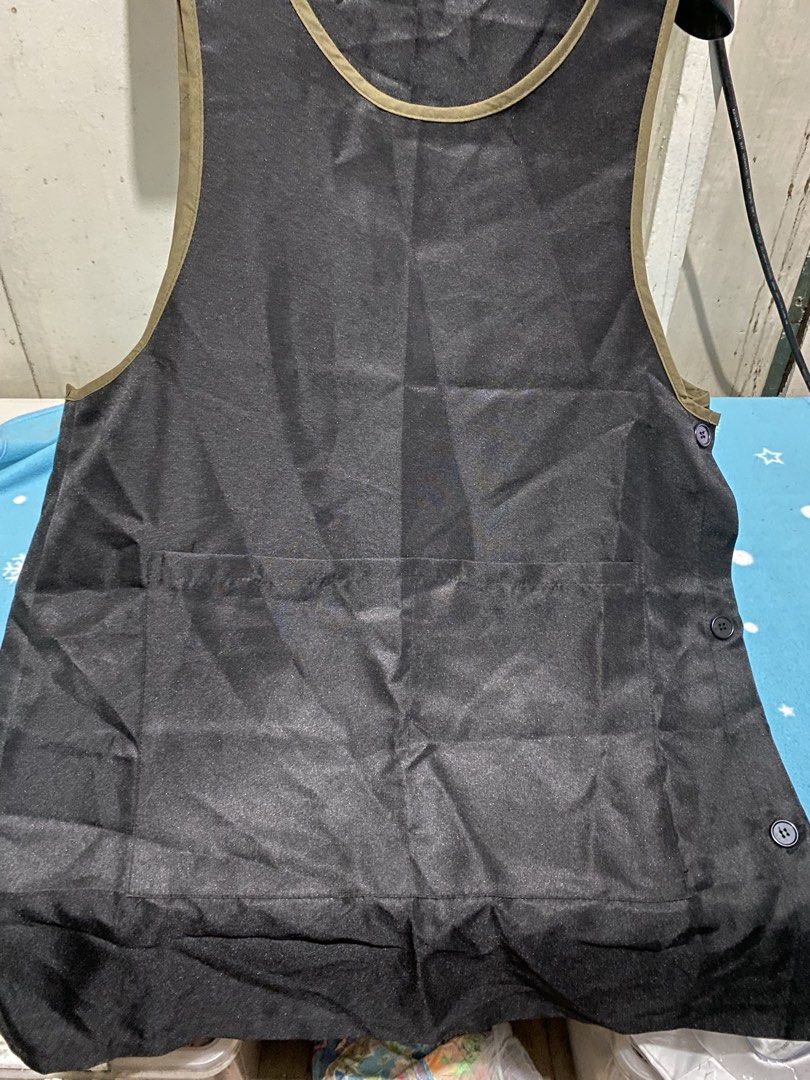 Black Apron with Side Buttons and Pockets (Category: Coats, Jackets and Outerwear) located in Manila. Submitted by resi.diaz (Listing ID 1456539070, Image 2). Description: - Black apron with stylish olive green trim - Two convenient front pockets - Easy side button closure - Versatile for cooking, crafting, work, or home use - Simple to wear and maintain (easy to clean).